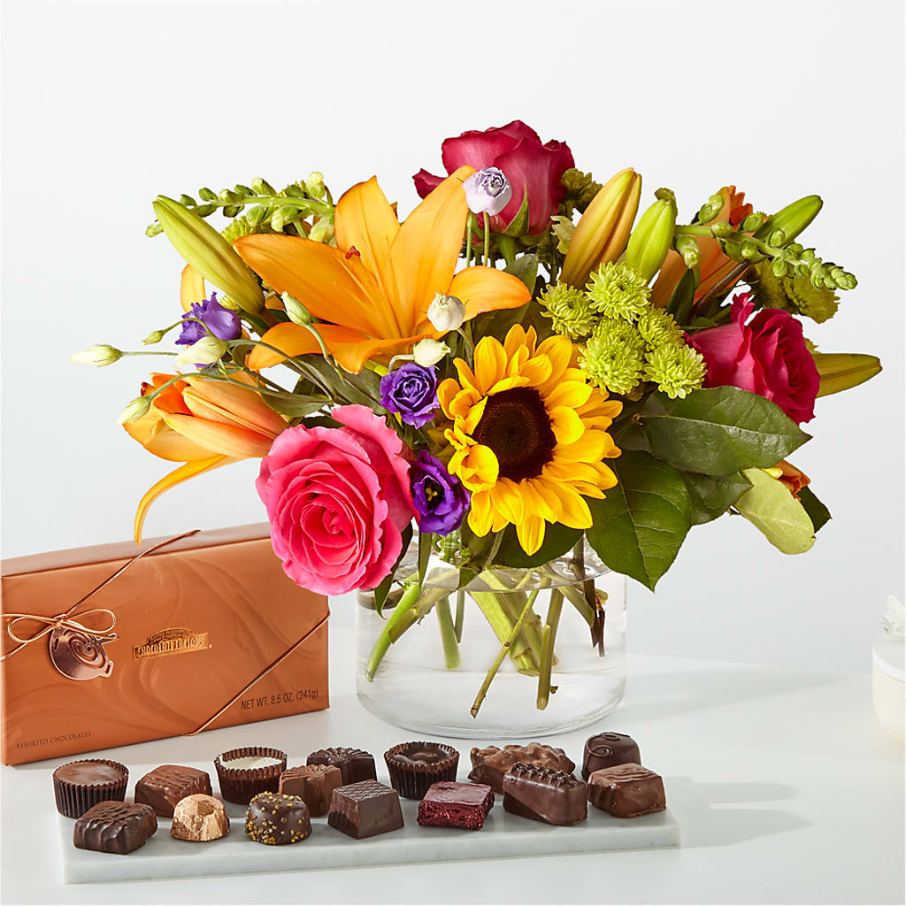 Bouquet du meilleur jour et paquet de chocolat