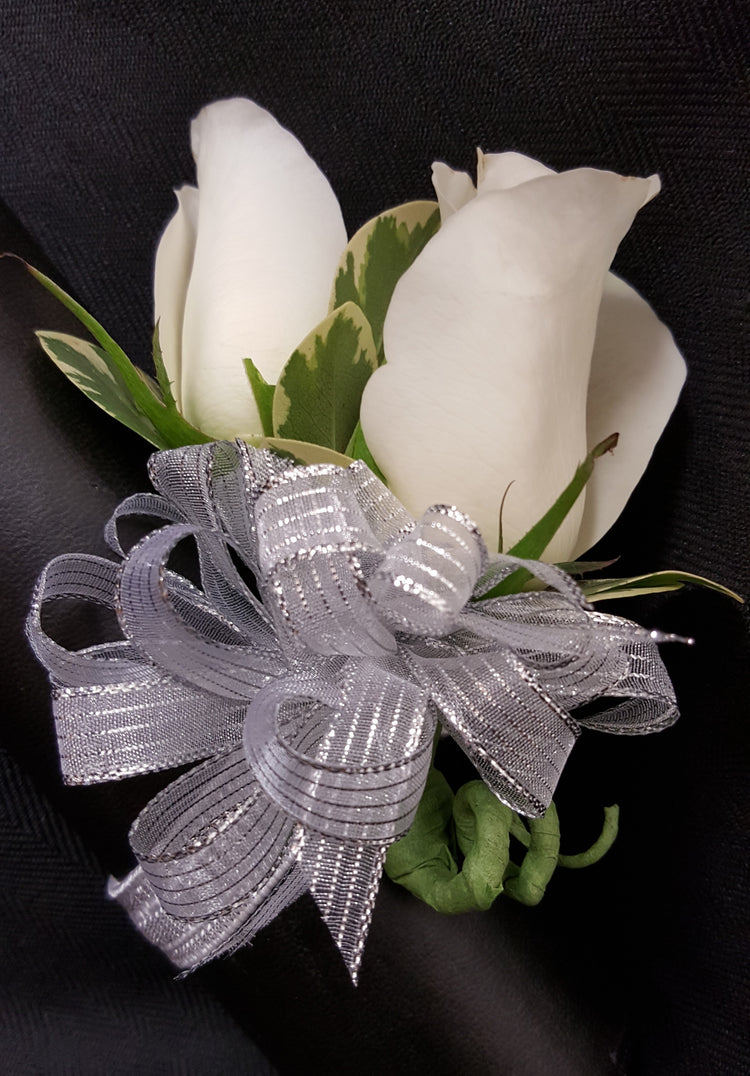 A beautiful wrist corsage of fresh roses any choice of color along with a ribbon to match!