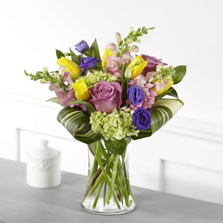 Within our Wondrous Memories Bouquet, your messages of sympathy are complemented with bursting tulips, roses, hydrangea and double lisianthus in radiant garden hues. standard size
