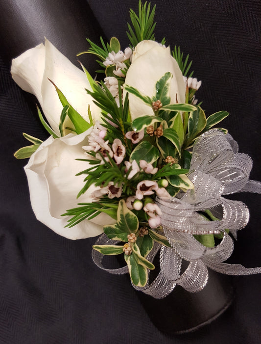 FOR PICK UP ONLY IN OUR LOCAL TARZANA CA LOCATION  - Please call 818 344-8400 to place your order.  A beautiful wrist corsage of fresh roses any choice of color along with a ribbon to match!